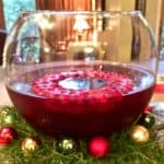 Santa Clause Christmas punch in a clear glass punch bowl.