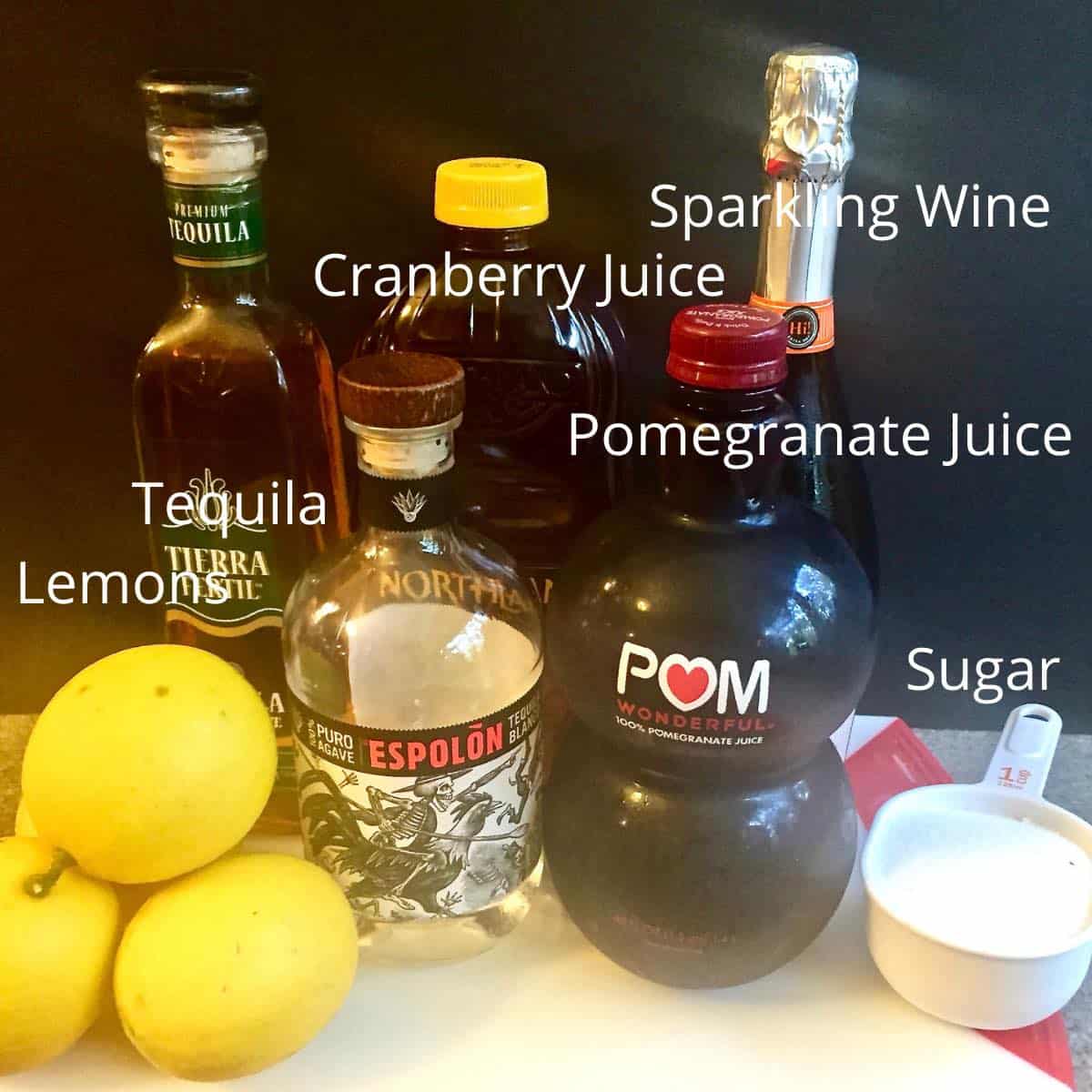 Lemons, tequila, pomegranate juice and other ingredients for punch. 