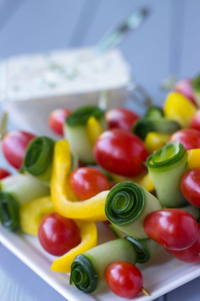 Veggie skewers made with yellow bell pepper, zucchini and cherry tomatoes. 