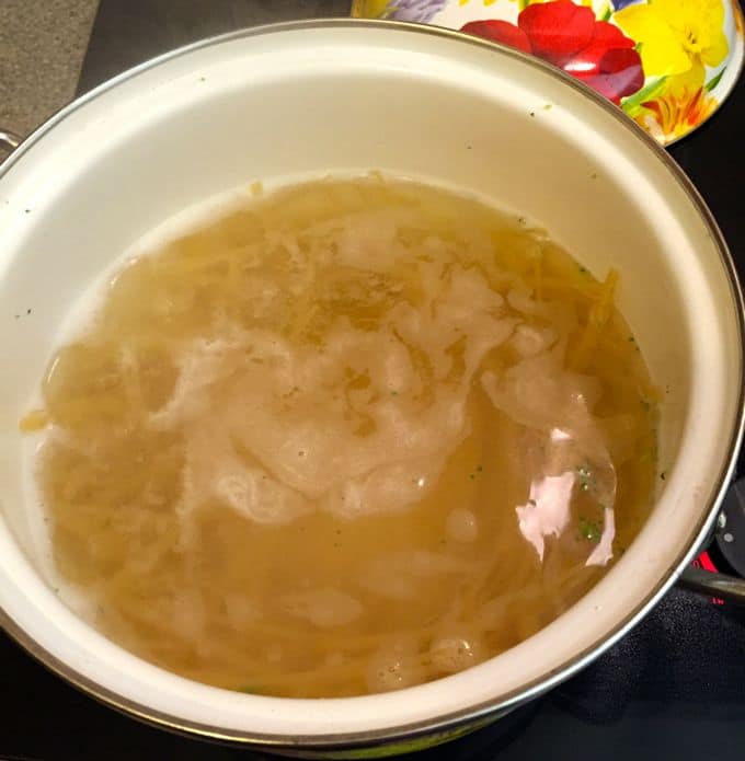 Cooking the fettuccine in the large pot of water.