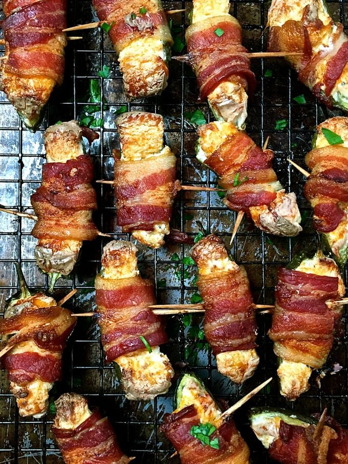 Baked poppers wrapped in crispy bacon right out of the oven. 