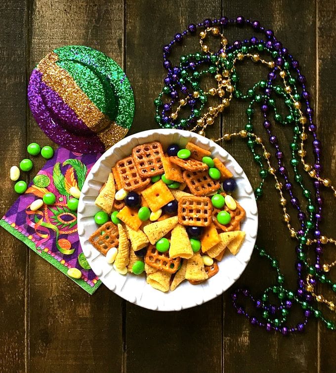 Mardi Gras snack mix with mini pretzels, bugles, and green, purple, and yellow M&Ms.