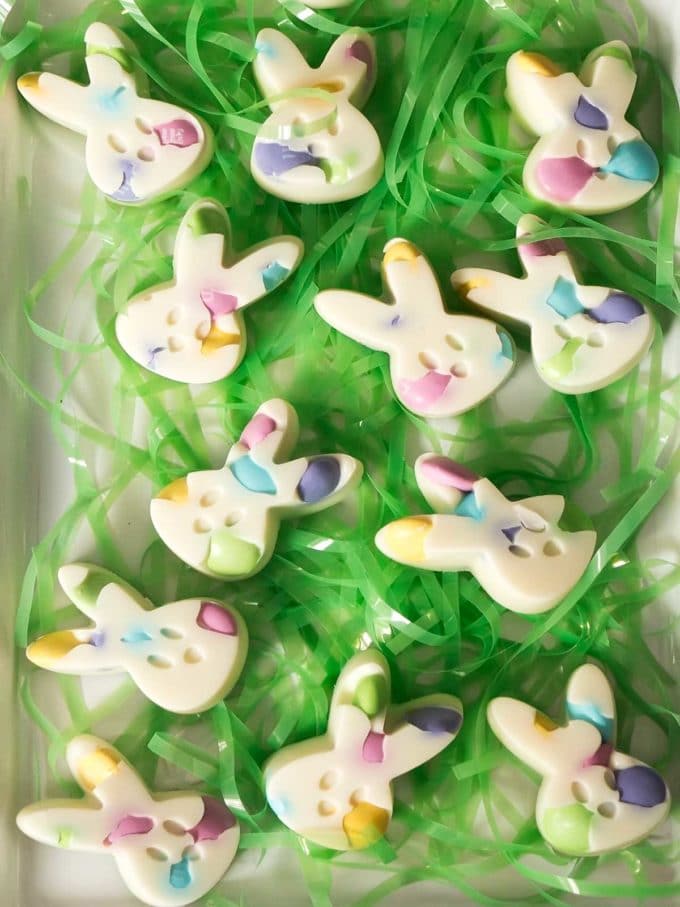 Candy Easter bunny heads with green Easter grass. 
