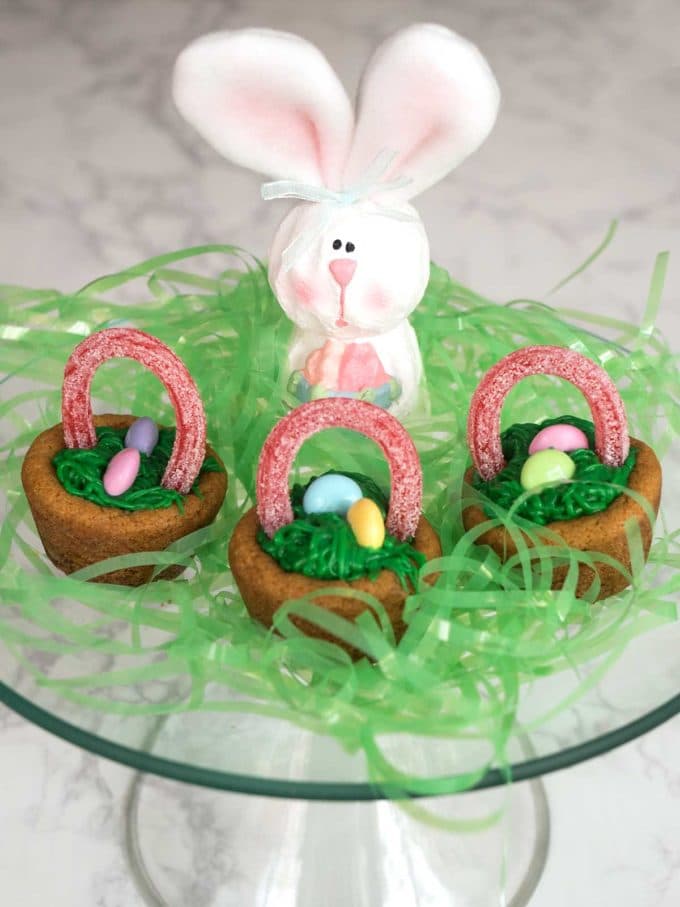 Three tiny easter baskets full of jelly beans. 