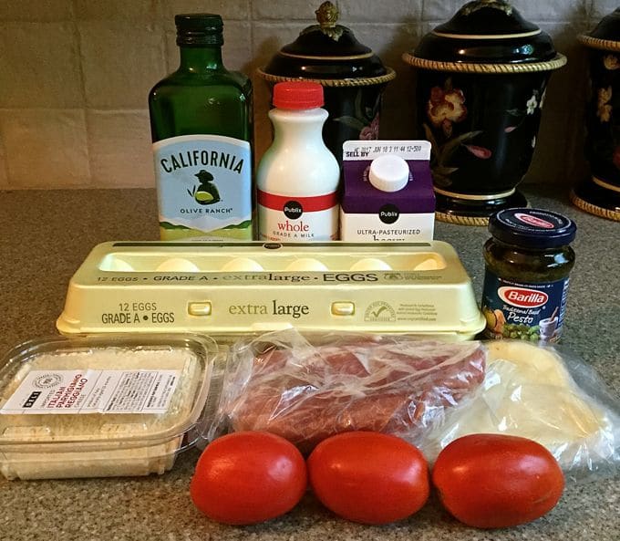 Ingredients for Prosciutto Breakfast Casserole including eggs and tomatoes. 