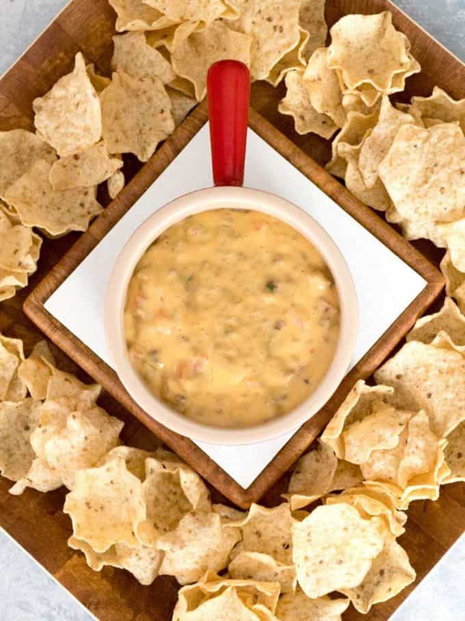 Yummy Spicy Sausage Queso Dip surrounded by chips and ready to eat