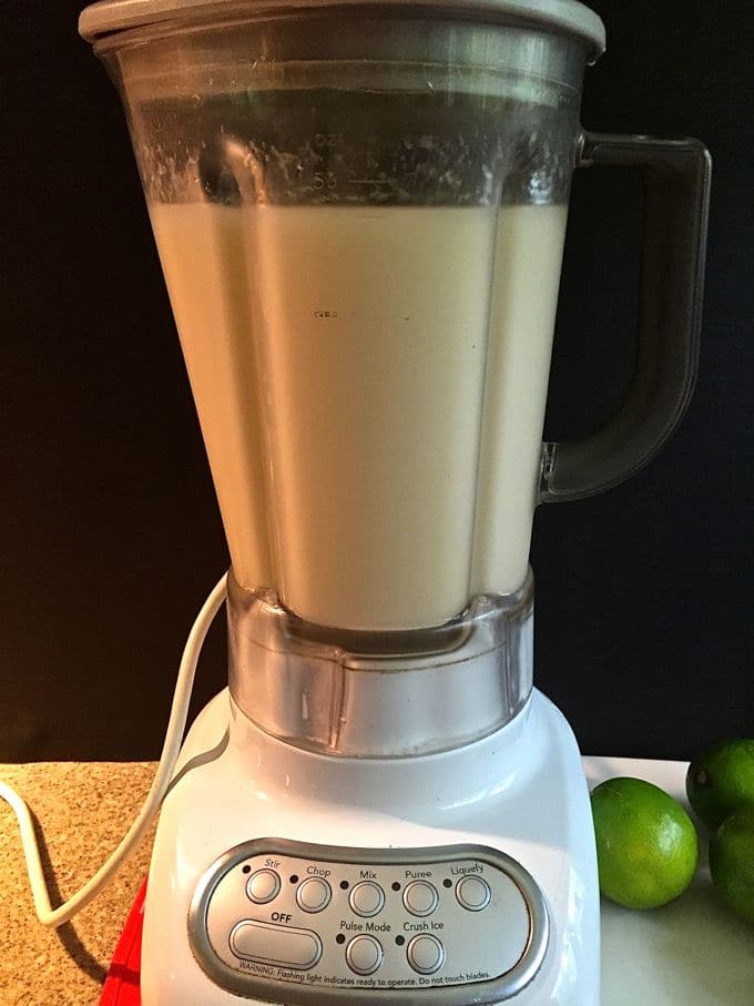 Frozen margaritas in a blender ready to serve. 