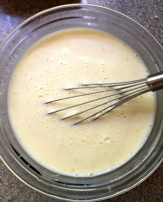 Cooked custard in a clear glass bowl. 