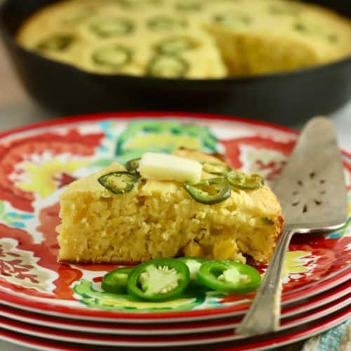 A slice of Mexican jalapeño cornbread. on a colorful plate.