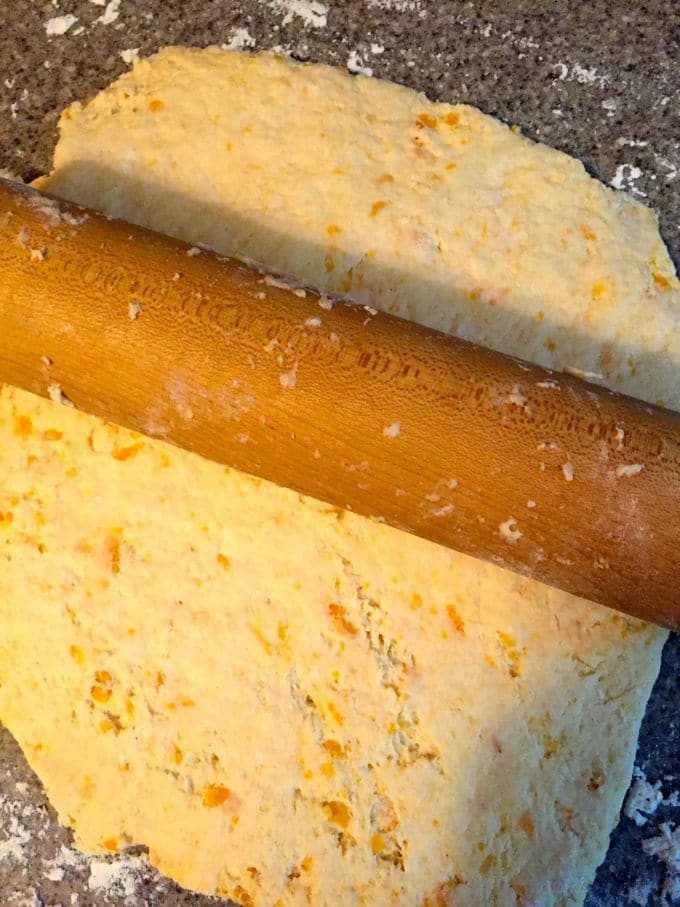 Sweet Potato Biscuit dough rolled out with a rolling pin.