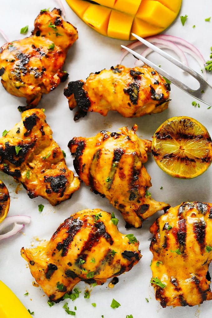 Mango lime grilled chicken on a baking sheet. 