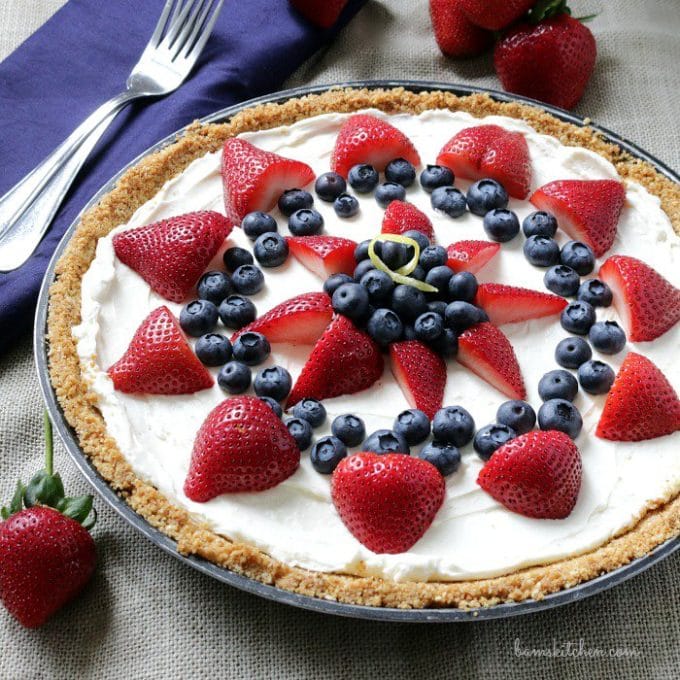 Skinny Berry Cheesecake Bars with strawberries and blueberries. 
