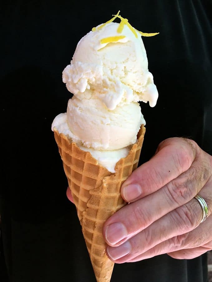 Two scoops of Lemon Ice Cream in a sugar ice cream cone. 