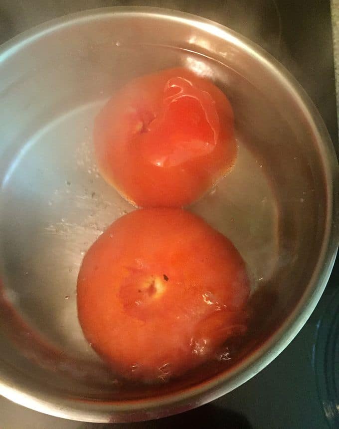 Southern Spicy Tomato-Cheese Grits blanching the tomatoes.