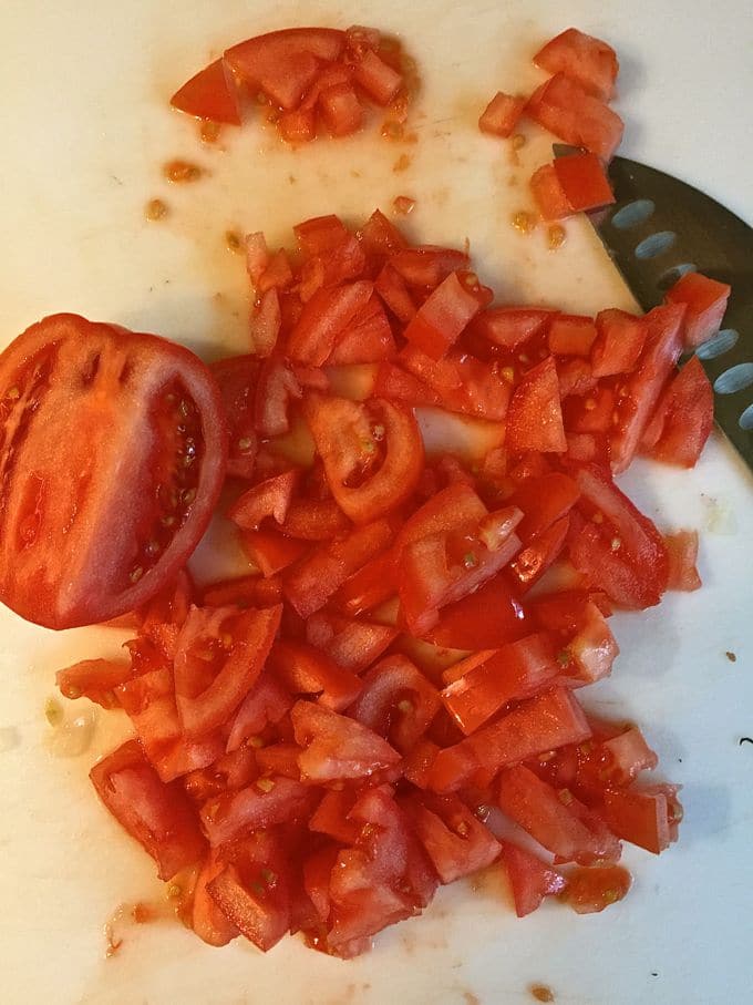 Chopped tomatoes for Tomato Cobbler with Cornbread-Cheddar Biscuits