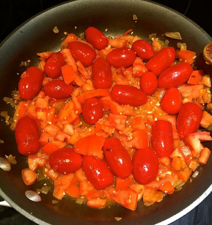 Cooking tomatoes for Tomato Cobbler with Cornbread-Cheddar Biscuits