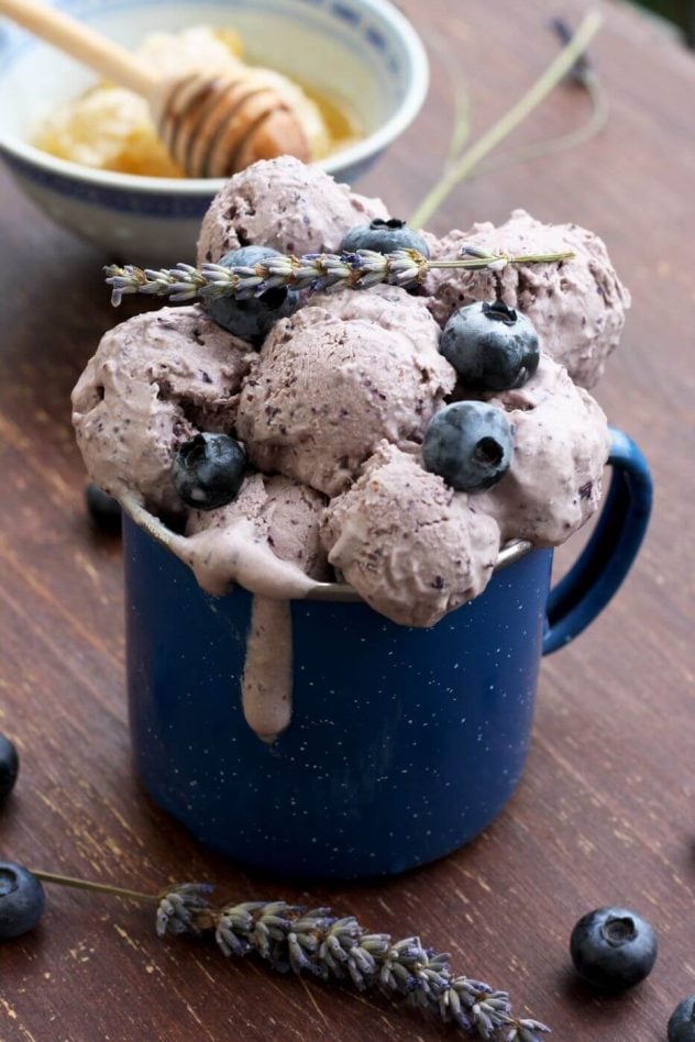 Scoops of Sugar Free Blueberry Ice Cream with Lavender in a blue coffee mug. 