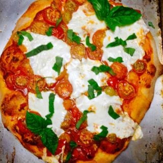 Rustic Roasted Cherry Tomato Pizza showing roasted tomatoes and cheese