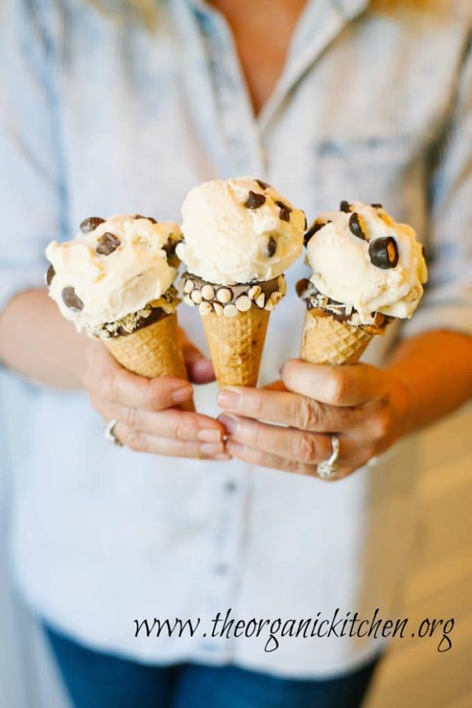 Vanilla Bean Ice Cream with Hand Dipped Cones studded with pieces of chocolate. 