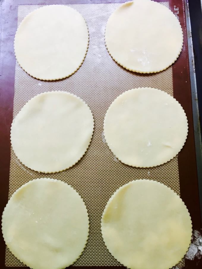 Pastry circles on a slip mat silicone baking mat.