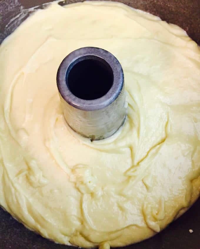 Cake batter in an angel food tube cake pan. 