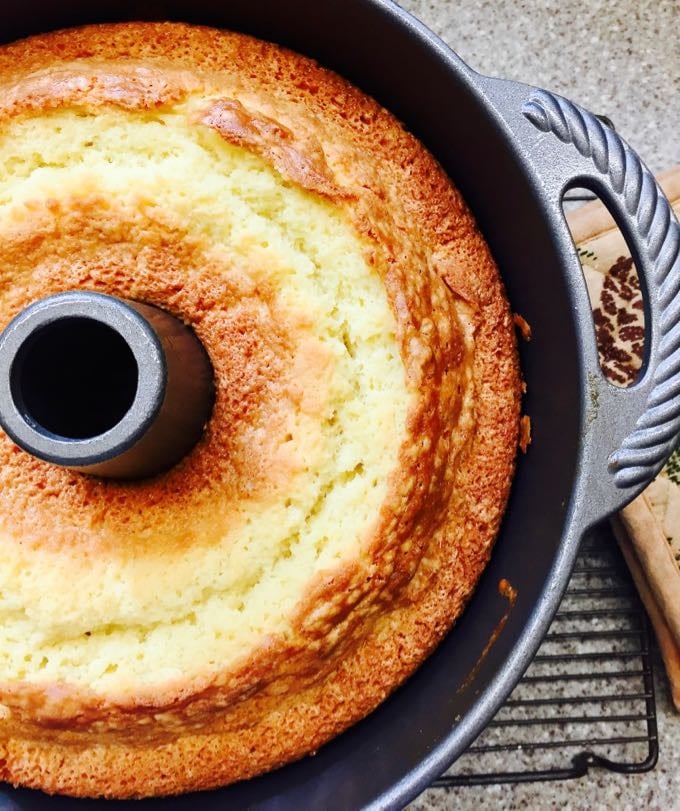 A pound cake right out of the oven and cooling in the pan.