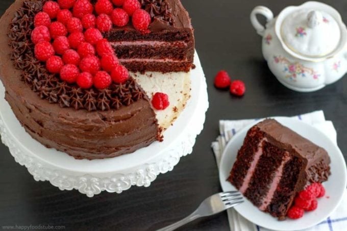 Red Wine Chocolate Raspberry Cake with chocolate icing and topped with fresh raspberries.