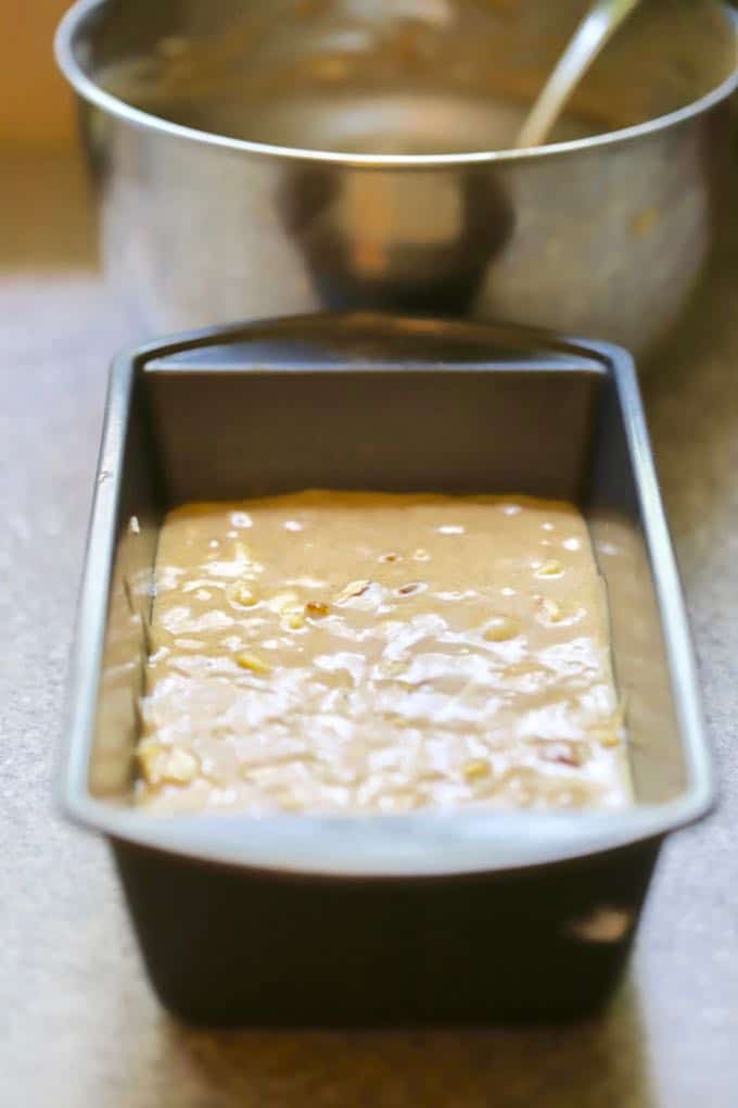 Apple bread batter in a loaf pan, ready to bake.