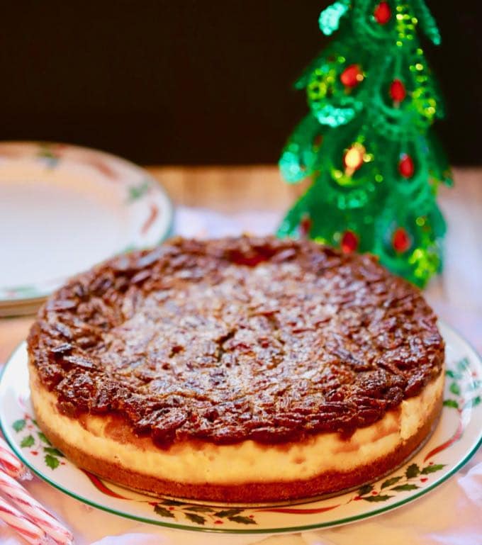 Southern Pecan Praline Cheesecake on a Christmas plate. 