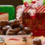Dark Chocolate Billionaires Candy is piled in a Christmas-themed bowl.