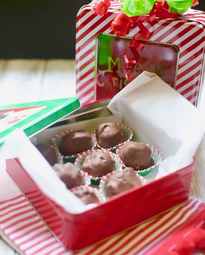 A gift box containing homemade chocolate Christmas candy.
