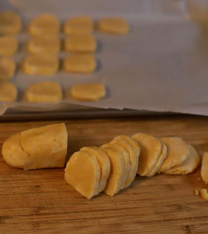 Slicing the logs for Crispy Cheesy Southern Cheese Crackers