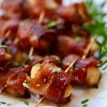 Easy Marinated bacon wrapped scallops with a garnish of chopped rosemary