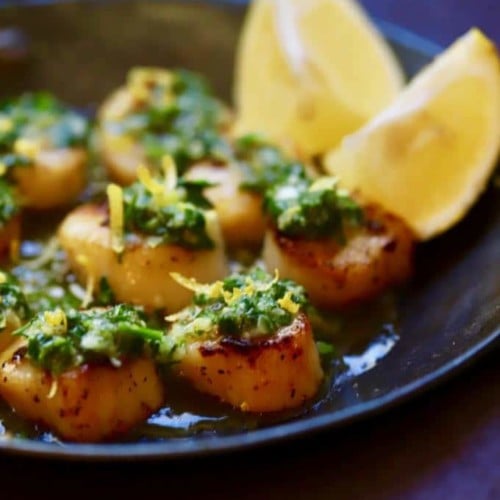 A pan full of Pan Seared Sea Scallops with Salsa Verde