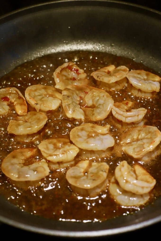 Cooking the shrimp in a skillet for Spicy Shrimp and Broccoli Stir-Fry