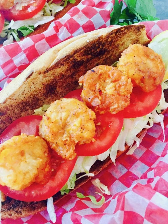 Spicy Shrimp Po' Boy Sandwich loaded with shrimp, lettuce and tomatoes