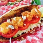 Spicy Shrimp Po' Boy Sandwiches topped with blue cheese crumbles