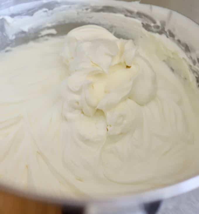 A bowl of cream cheese whipped cream filling for Chocolate Cherry Brownie Parfaits