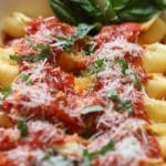 Hot, right out of the oven a baking dish full of Easy Stuffed Shells with Marinara Sauce