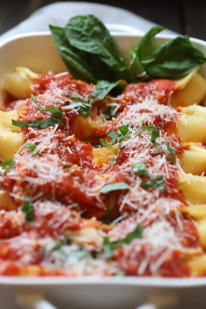 Hot, right out of the oven a baking dish full of Easy Stuffed Shells with Marinara Sauce