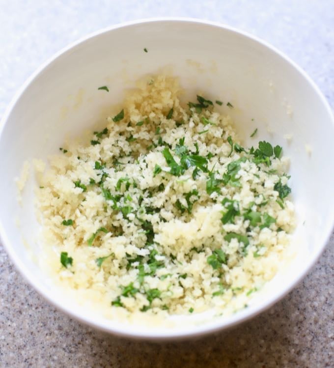 Mixing panko, butter and parsley in a small bowl to top Hot and Cheesy Baked Shrimp Scampi Dip