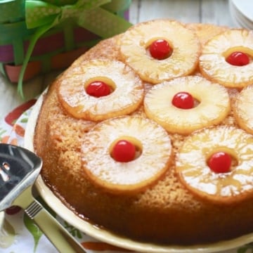 Easy Pineapple Upside Down Cake ready to serve topped with pineapple slices and cherries