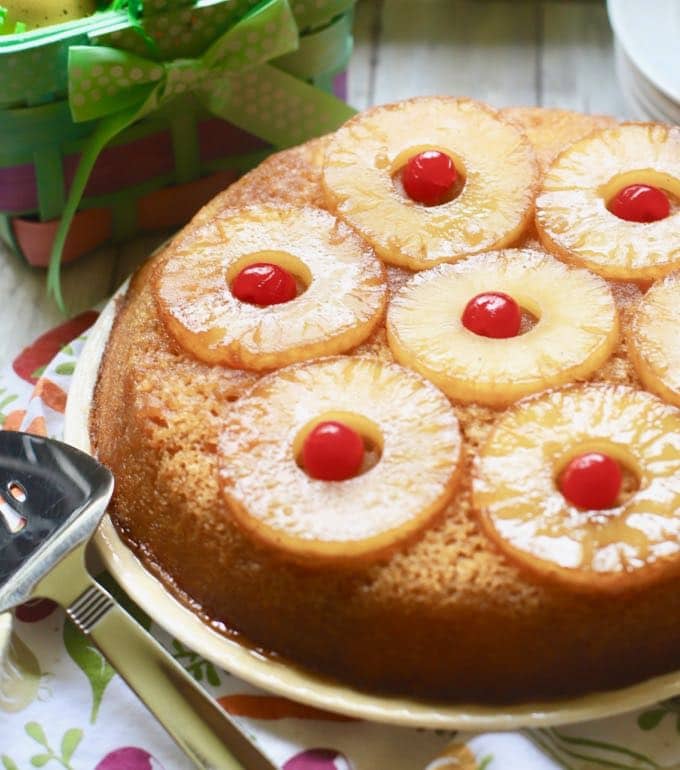 Easy Pineapple Upside Down Cake ready to serve topped with pineapple slices and cherries