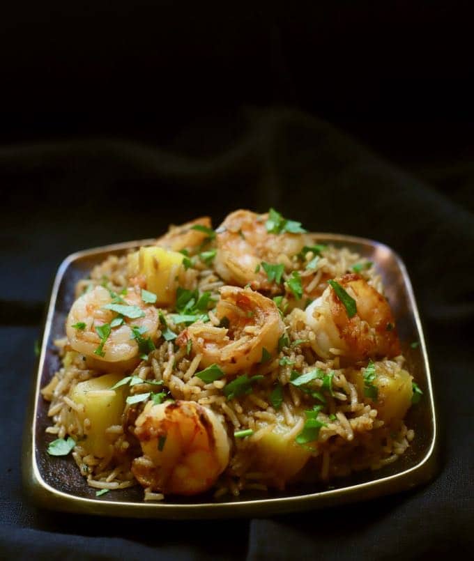 Easy Shrimp and Pineapple Fried Rice on a metal plate and ready to serve