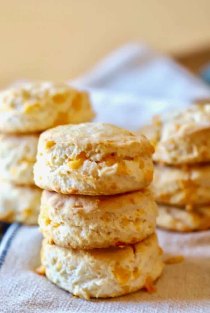 Southern Cheddar Biscuits in three stacks of three, hot out of the oven.