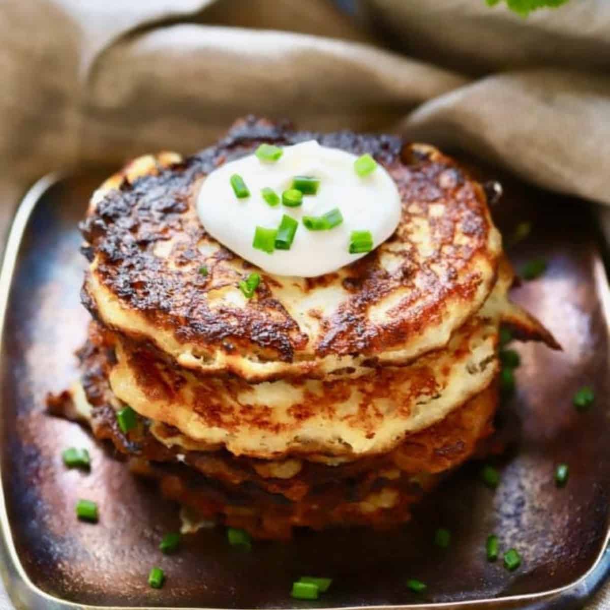 Irish potato boxty topped with sour cream.