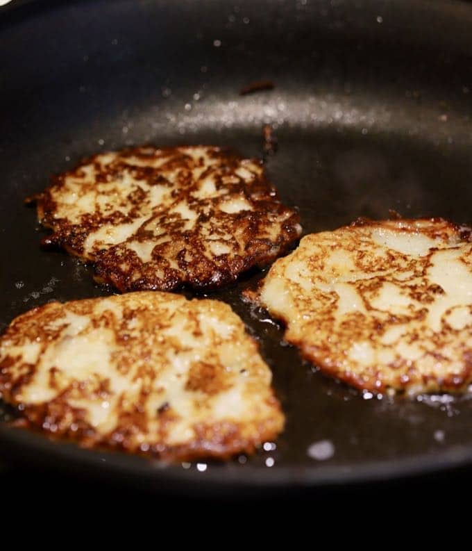 Cooking boxty in a skillet.