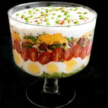 Classic Southern Seven-Layer Salad in a trifle dish