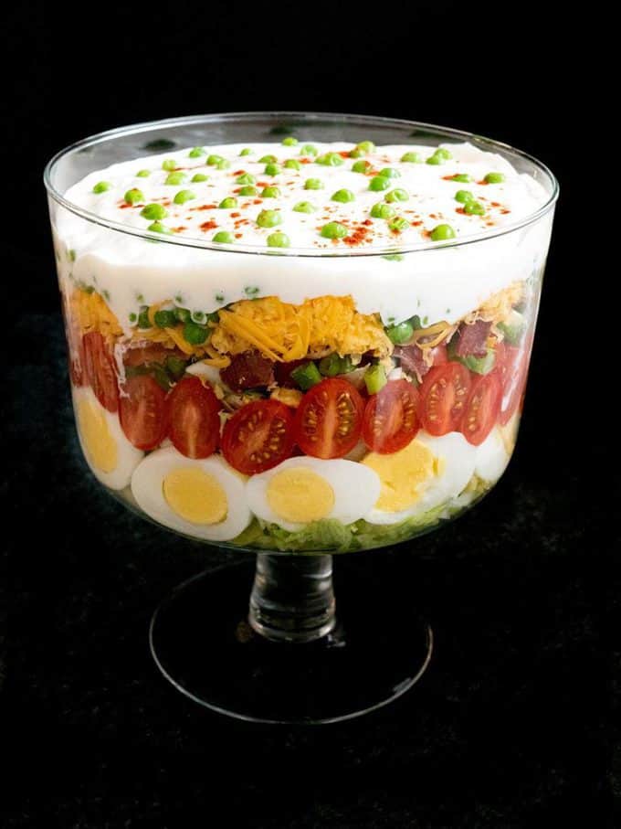 Classic Southern Seven-Layer Salad in a trifle dish