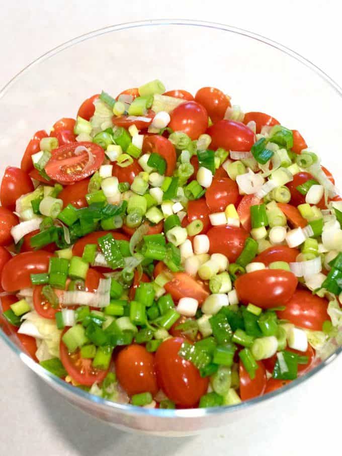 The first four layers of Classic Southern Seven-Layer Salad in a glass trifle dish